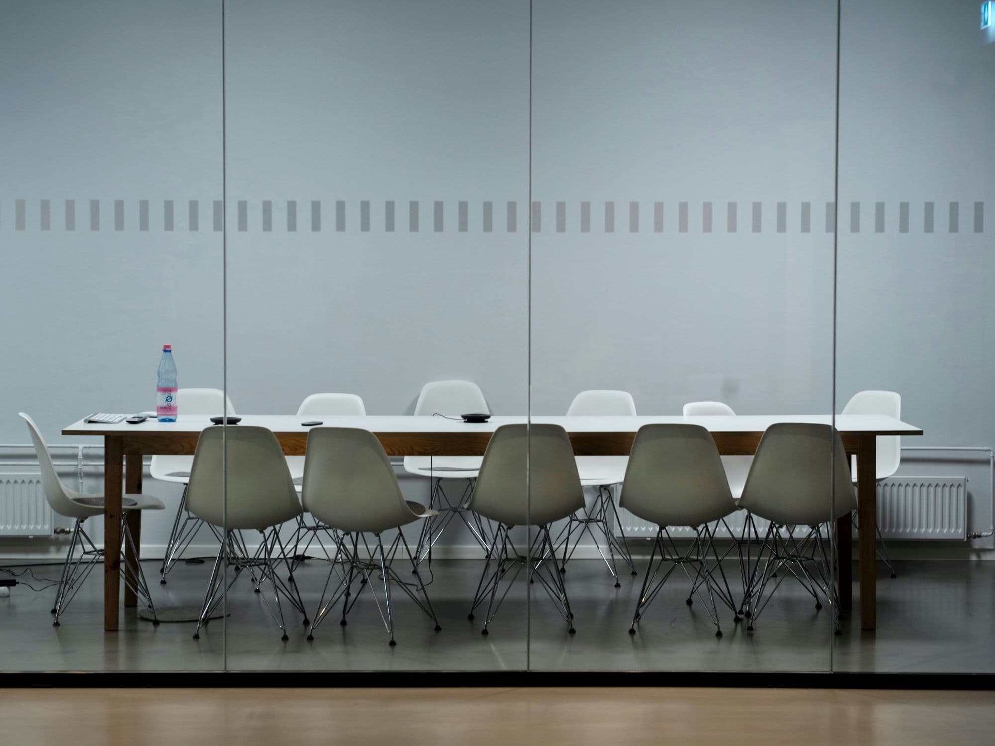 Workers collbaorating over specification documents