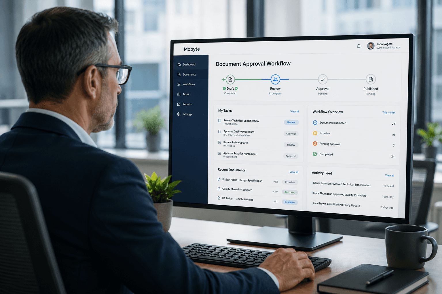 Man working on document approval workflow on a laptop