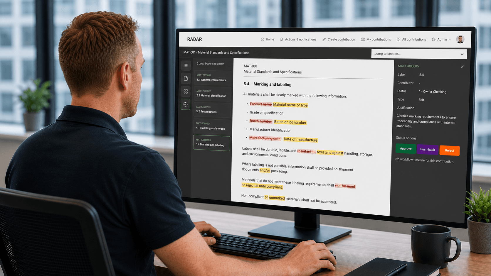 Man working on document approval workflow on a laptop